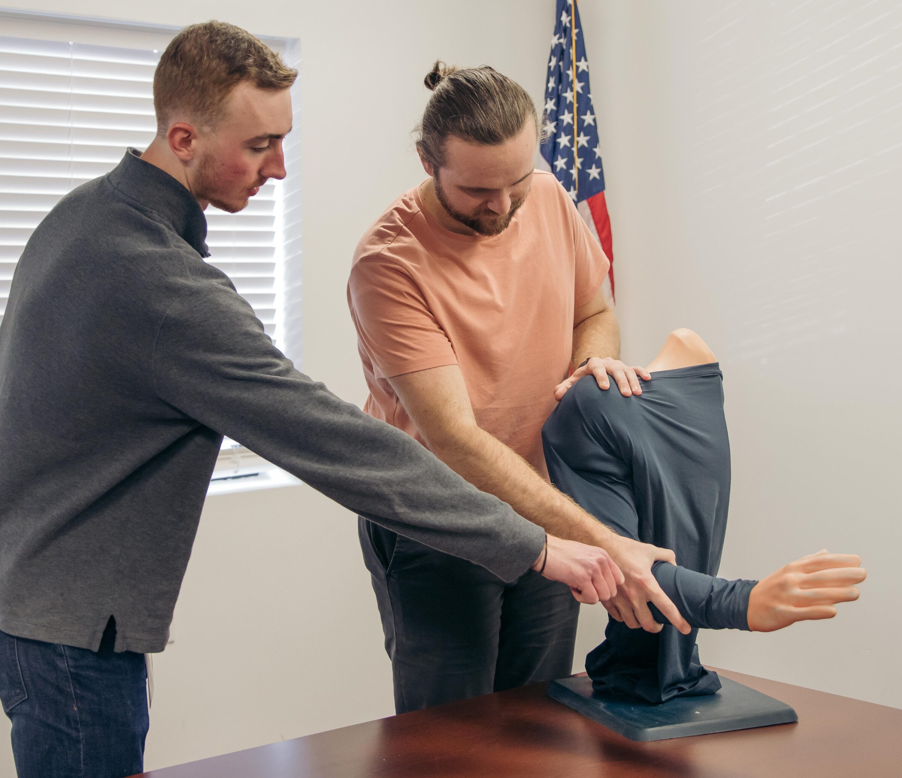 Demonstration of a shoulder joint reduction trainer.
